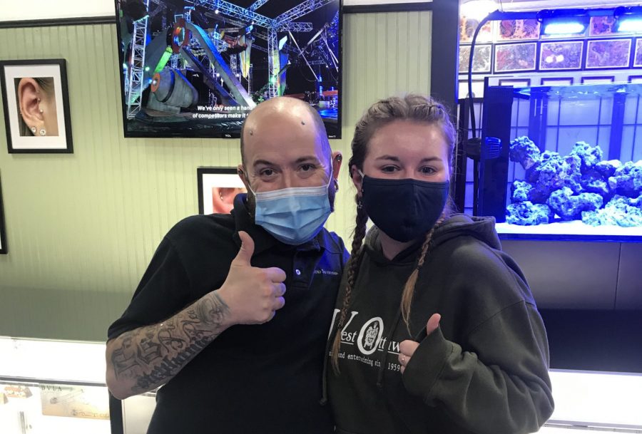 Steve Olin poses with Meagan Rockafellow after piercing her rook