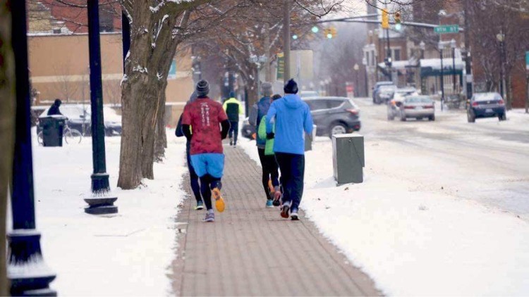 Runners regularly run downtown on the snowmelt during the winter