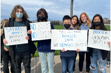 Students participate in the protest to support Patrick Lyoya.