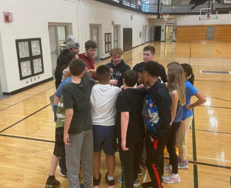 The Unified Basketball team in a huddle after their practice