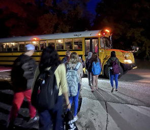Students file onto the bus ready for a day of school