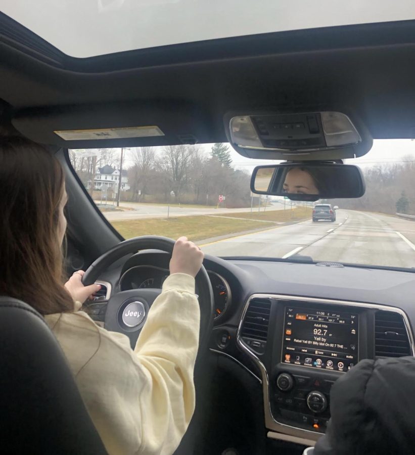 Dani Minarik drives down a highway in order to get enough hours to take segment 2 of drivers training in Michigan.