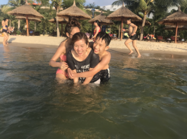 Mike Doan with his mom and sister swimming in Vietnam