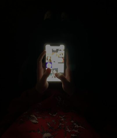 Sr. Kira Guerrin scrolling through her Instagram explorer page