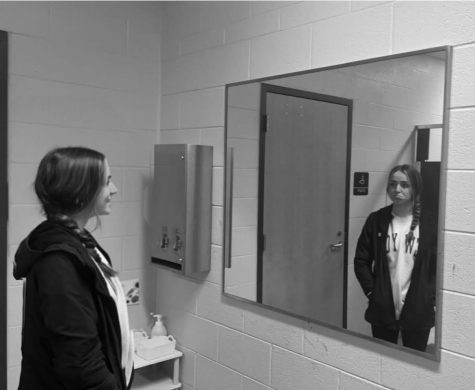 Dani Minarik smiles at herself in the mirror but only sees a flawed reflection.