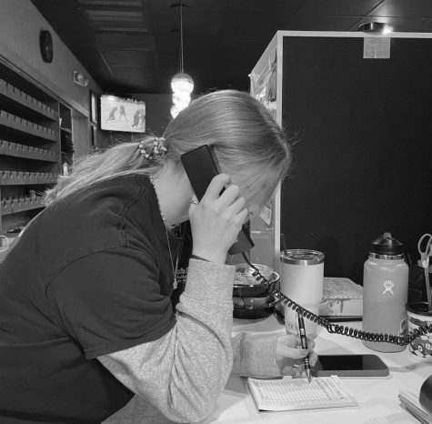 Kuyper answering a phone call at work