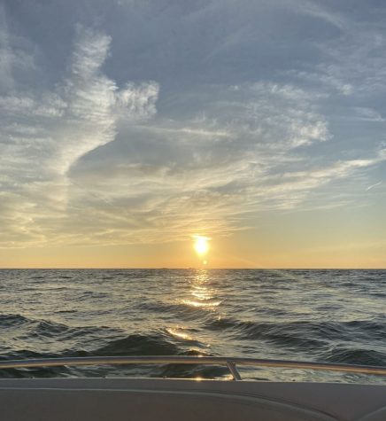The view of sun setting over the horizon at the Holland State Park