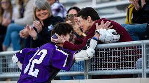 Sr. Cooper Nienhuis embraces a loved one who has battled cancer