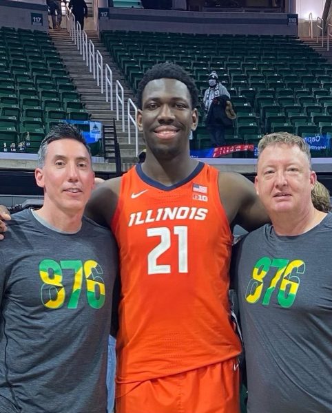 Coach Plank and Coach Turner meet up with Kofi Cockburn after a game at Michigan State