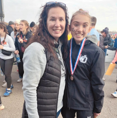 Jr. Helen Sachs and her mom celebrate her success at the state meet.