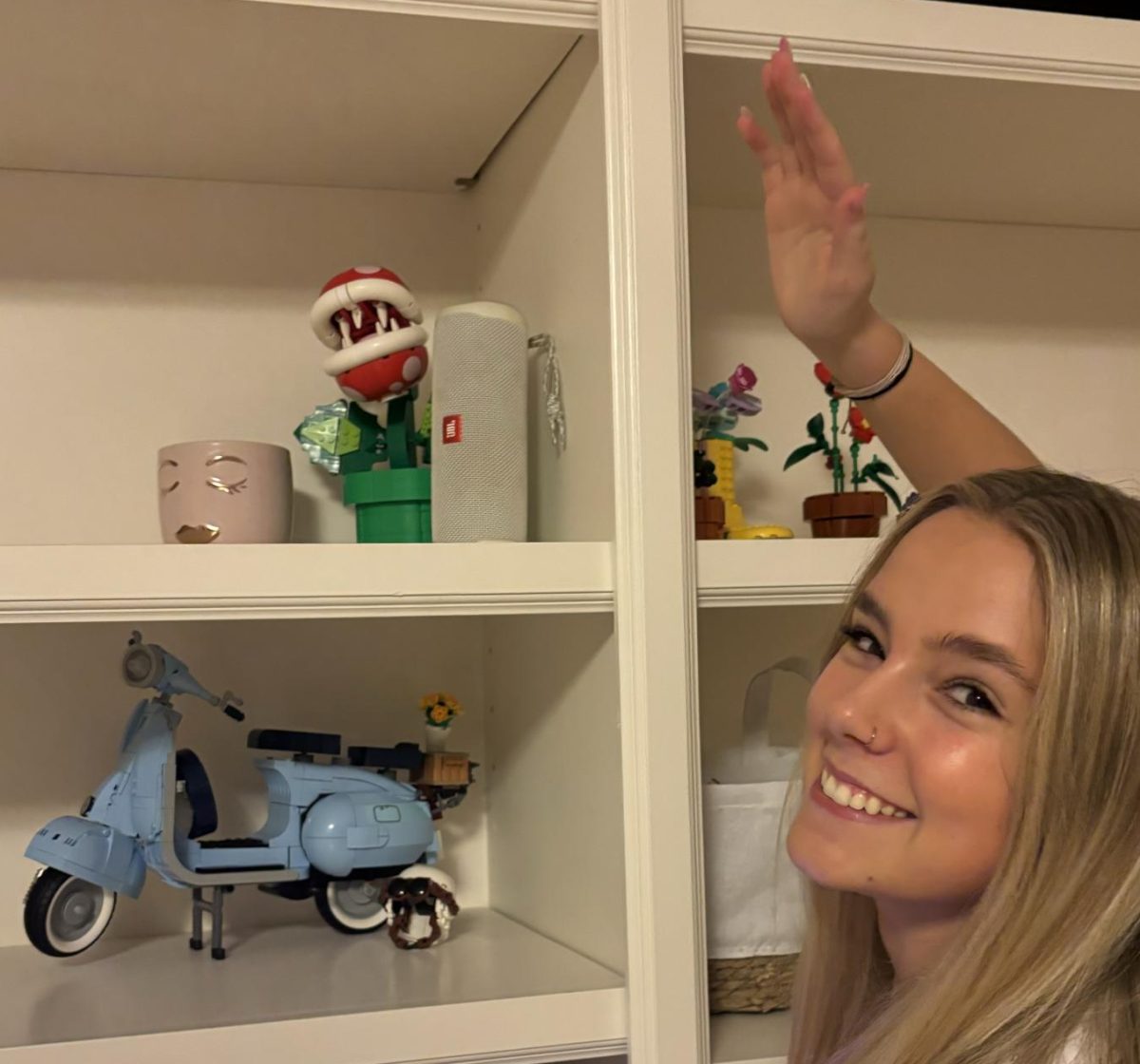 Lizzie Holstege stands with some of her favorite LEGO creations