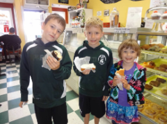 Ethan (10), Brendan (8), and I (5) at a donut shop on Mackinac Island in 2012.
