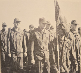 Scott Weliver in basic training with the Air Force (pictured in middle).