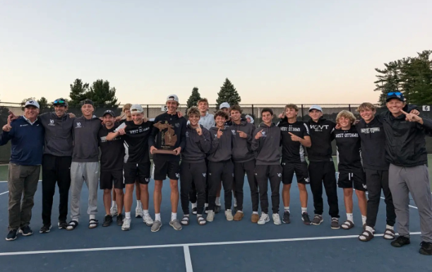 The tennis celebrates after their regional championship. 