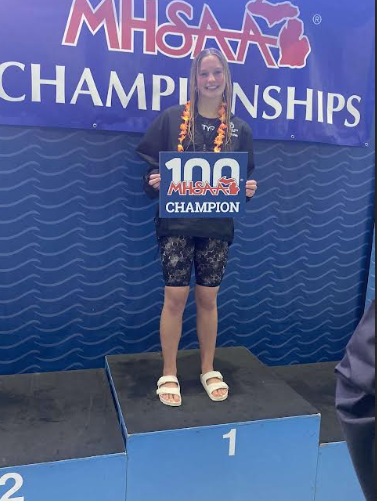 Makenzie Baldwin seconds after winning the  100 backstroke at state