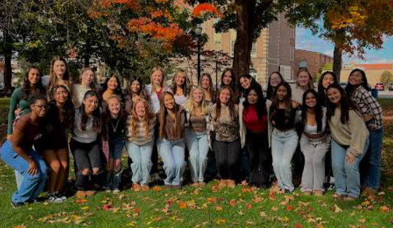 The cheer team photo does not hint at the injuries and recovery that are a part of the sport.