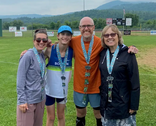 Eric Wilkinson and family after completing a mararthon in New Hampshire, one of 30 states in which he has accomplished the task.