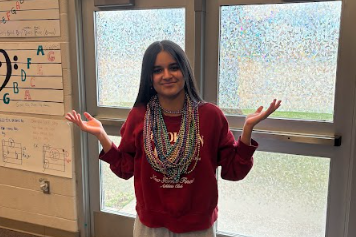 Sr. Arisella Rios poses after winning an extra 14 beads.