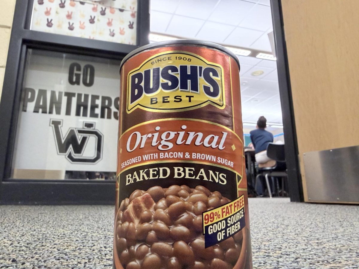 A can of Bush's Original baked beans looms over the school hallway.